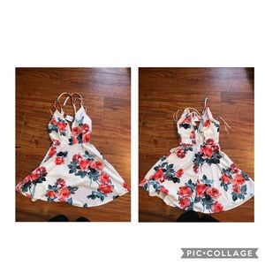 A white floral dress with a deep v neckline